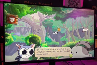 Ein Monitor, auf dem das Spiel Yarn angezeigt wird.